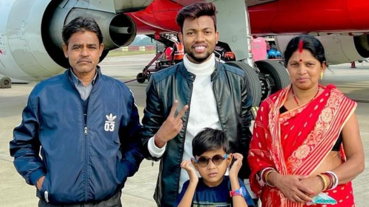 Manoj Dev standing with his family at an airport, showcasing a moment of togetherness. This image reflects his successful journey from humble beginnings to achieving financial stability, as discussed in the topic of Manoj Dev Net Worth.